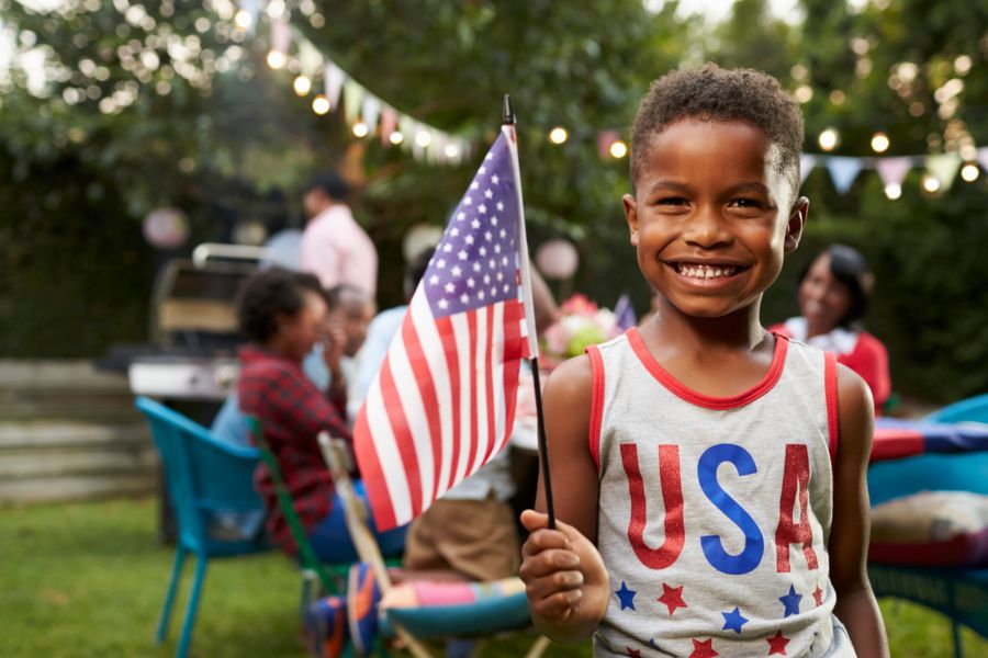 young boy holding flag